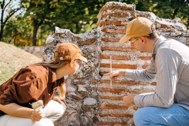 College students working at old historical archeology field