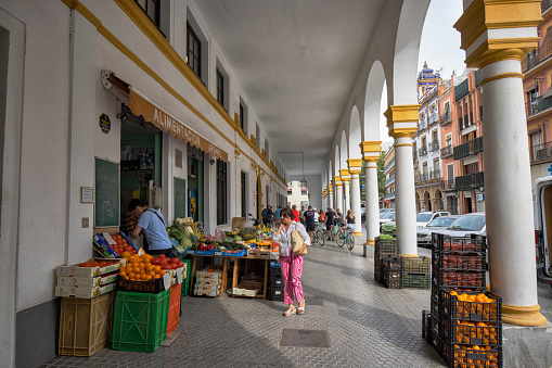 A fruit and vegetable store in a residential building, Seville, Spain.