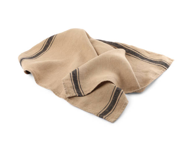 istock Beige cloth napkin with stripes isolated on white 1737714272