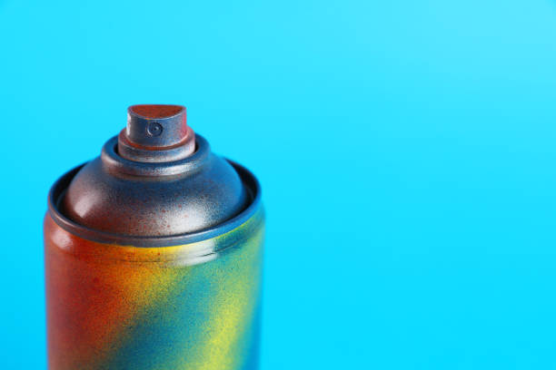 istock Used can of spray paint on light blue background, closeup. Space for text 1737715422