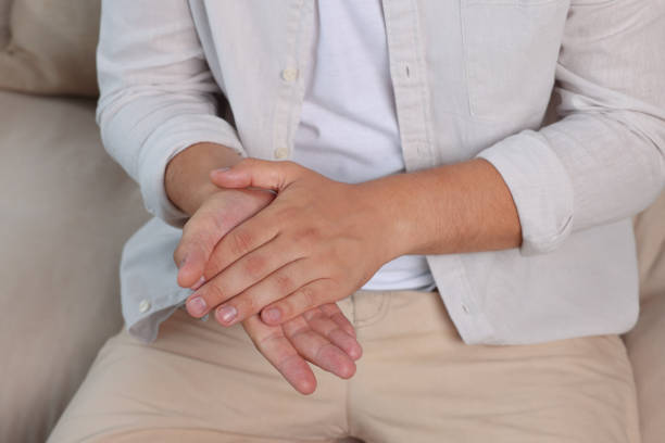 istock Man applying hand cream at home, closeup 1737718355