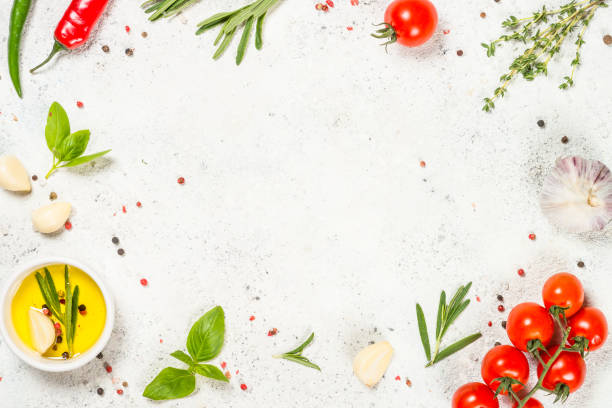 istock Herbs, spices and vegetables at white kitchen table. 1737737133
