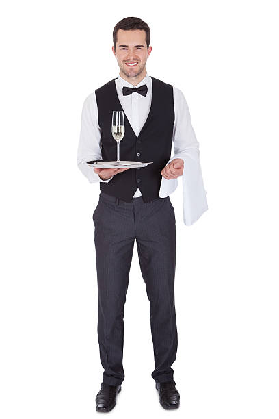 zdjęcie radosny młody butler - butler champagne service waiter zdjęcia i obrazy z banku zdjęć