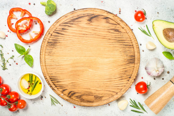 istock Herbs, spices and vegetables at white kitchen table. 1737738225