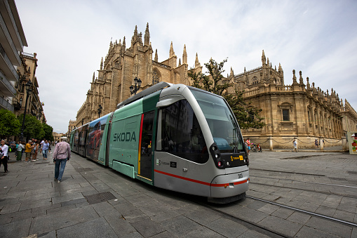 A Tram passing by Seville Cathedral, Spain