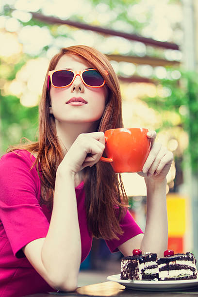 istock Style redhead girl with cake and cup 173775483
