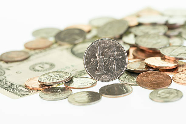 istock New York State Quarter with a dollar and coins close-up 173776920