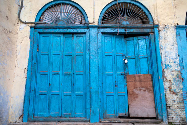 Colourful doorways found in the streets surrounding the Jama Masjid in Delhi. Each doorway is a splash of colour against the backdrop of historical and architectural surroundings, capturing the local essence of this bustling area. These doorways serve as both functional entry points and unique artistic expressions, reflecting the diversity and culture of the community. The photographs aim to highlight the interplay between traditional architecture and contemporary design, making these doorways stand out as individual landmarks in their own right.