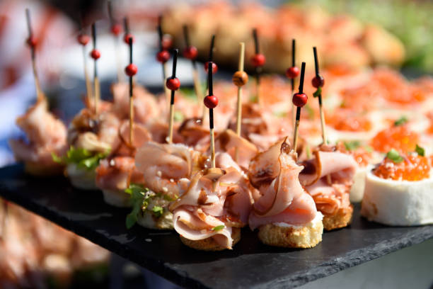 istock Snacks and canapes and tartlets stuffed in the assortment on the buffet table. 1737778929