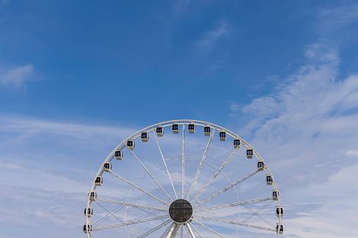 ferris wheel against a cloudy sky