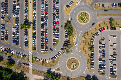 aerial view of the large parking lot with parked cars