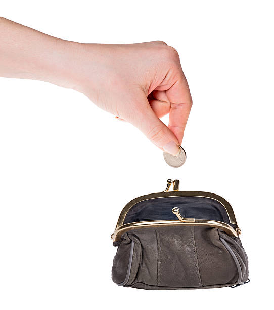 istock human hand put coin in purse isolated on white 173779128