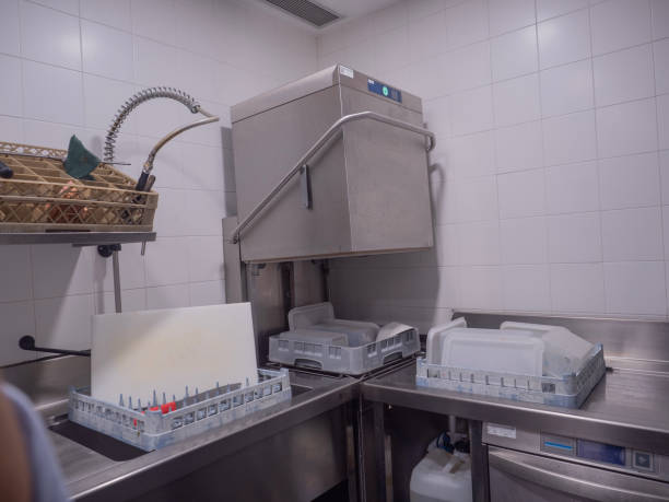 istock cleaning room, work space with industrial dishwasher, kitchen office, open dishwasher waiting for the next wash, 1737814718