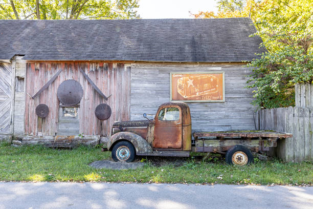 Old truck rusting by roadside