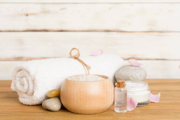 istock Spa composition with pink roses on wooden table 1737838877