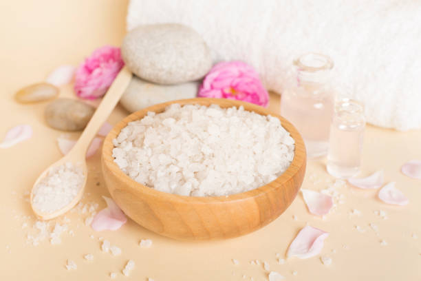 istock Spa composition with pink roses on wooden table 1737838880