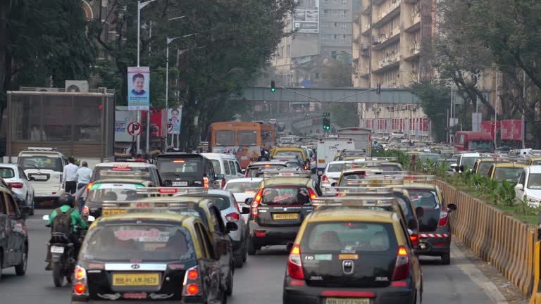 Rush Hour Traffic on the Streets Around Historic Landmark Victoria Station in South Mumbai, India