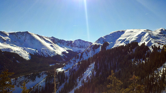 Taos Ski Valley New Mexico - Snow capped mountains - high midday sun