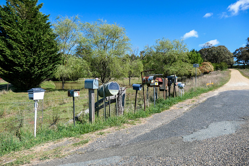 Letter boxes lined up on the road outside Grabben Gullen, a town in south-west New South Wales.  The name originates from an Aboriginal language meaning \
