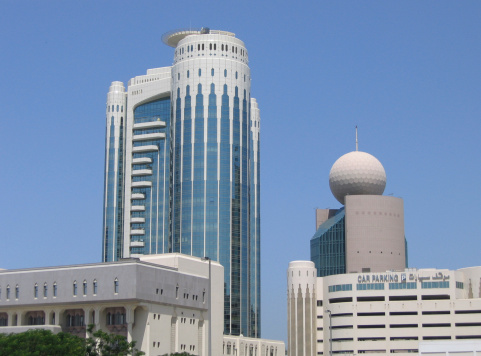 skyline of several high rise office buildings in dubai
