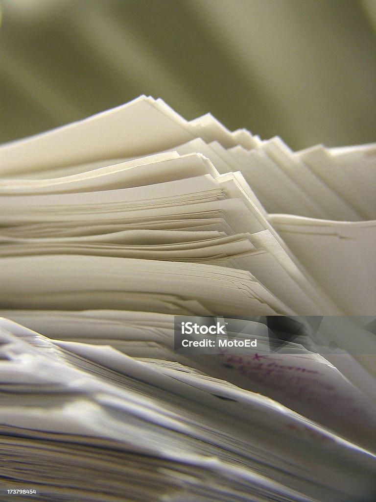 Paper Pile - 05 Part of a cluttered desk series Business Stock Photo