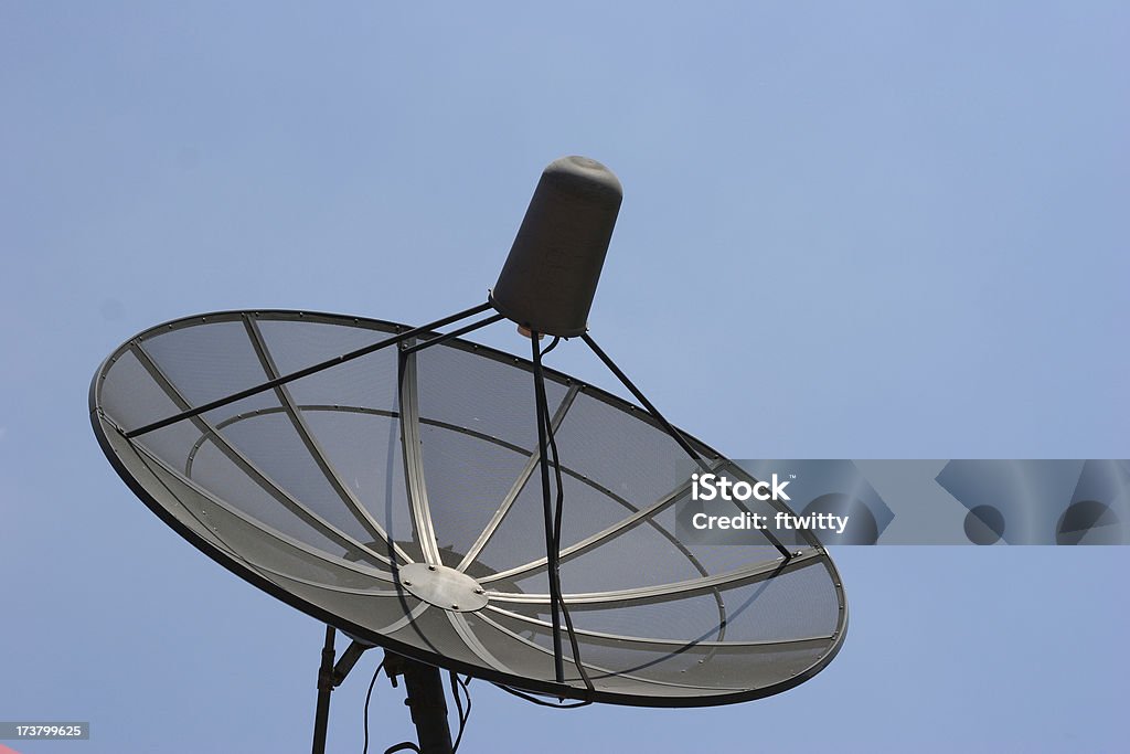Satellite Black satelite dish against clear blue sky Antenna - Aerial Stock Photo