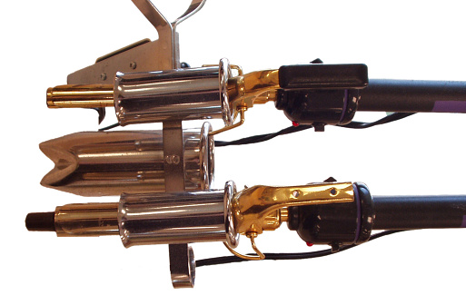 Curling irons in salon holder.