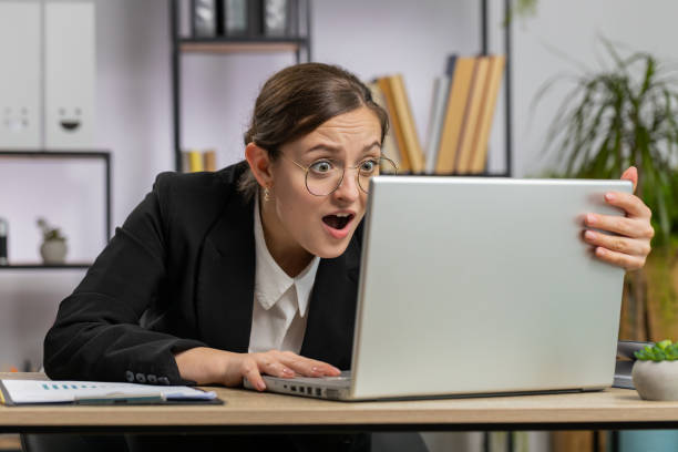 istock Irritated tired businesswoman working on laptop website problem, computer virus data loss by hacking 1738001878