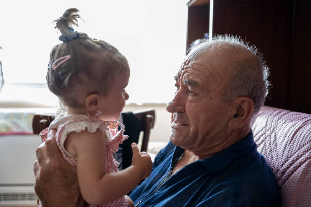 istock Grandpa plays with granddaughter. 1738003136