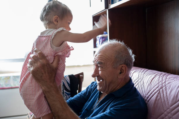 istock Grandpa plays with granddaughter. 1738003143