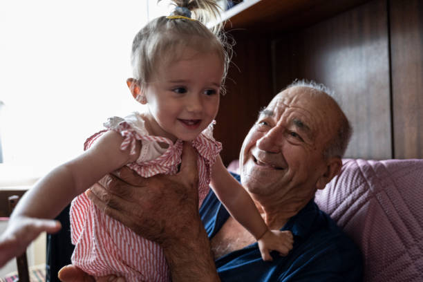 istock Grandpa plays with granddaughter. 1738003158