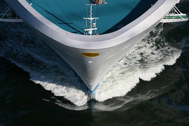 Bow Of Cruise Ship Cruise ship plows through the deep waters of the ocean. ships bow photos stock pictures, royalty-free photos & images