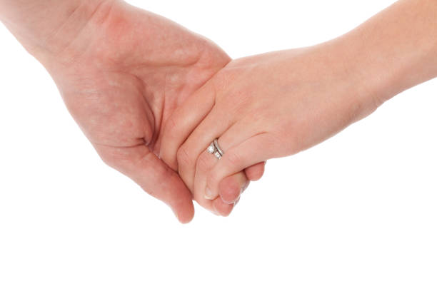 Man and woman holding hands.