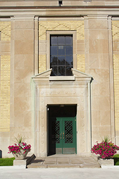 istock Windows and green doors on an old stone industrial building 173801546