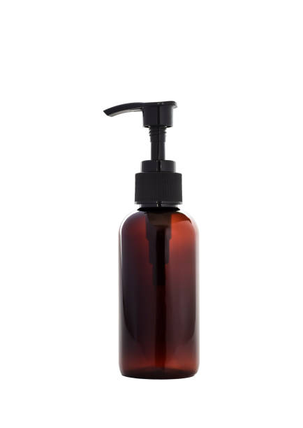 istock Amber colour dispenser bottle with a pump isolated cutout 1738028088