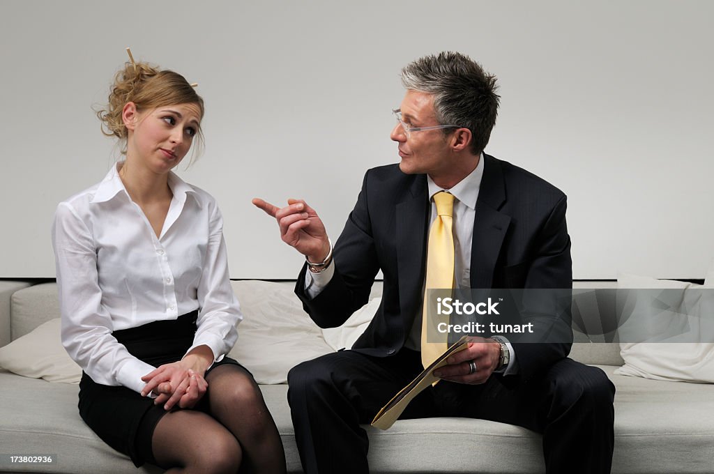 Scolding Businessman scolding businesswoman Adult Stock Photo