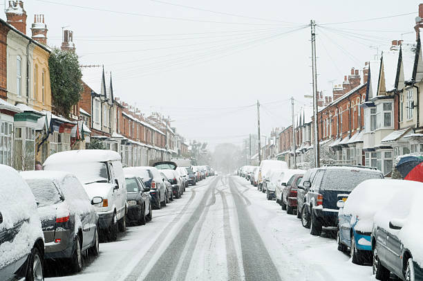 istock Suburban street in snowstorm 173803343