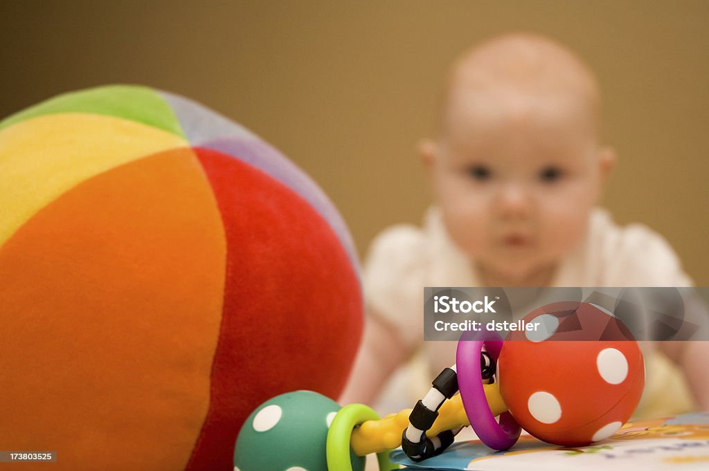 Playtime A baby going after toys and playing. Awe Stock Photo