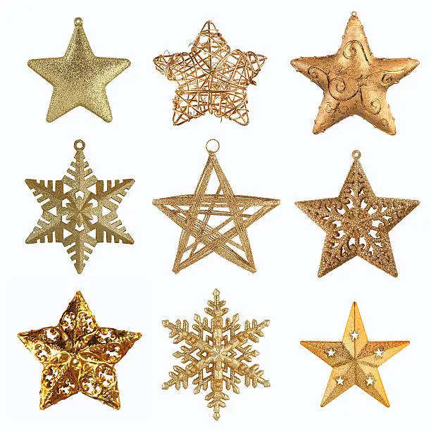 Various Christmas star-shaped decorations isolated on white.