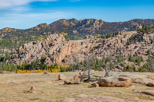 Stacks of huge boulders, autumn colors and extreme terrain in the Medicine Bow National Forest of Wyoming in western USA of North America. Nearest cities are Laramie and Cheyenne Wyoming and Denver, Colorado.