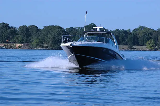 Photo of Cabin cruiser under power