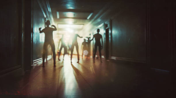 istock Spooky dark corridor with zombie horde 1738048221