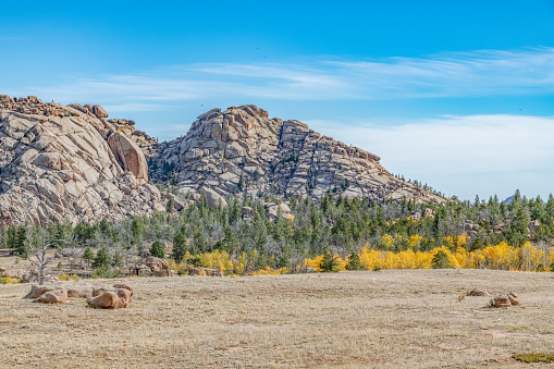 Stacks of huge boulders, autumn colors and extreme terrain in the Medicine Bow National Forest of Wyoming in western USA of North America. Nearest cities are Laramie and Cheyenne Wyoming and Denver, Colorado.