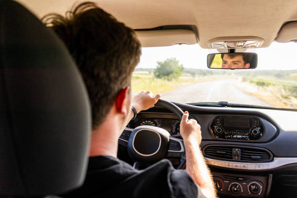 istock young man driving a car 1738061383