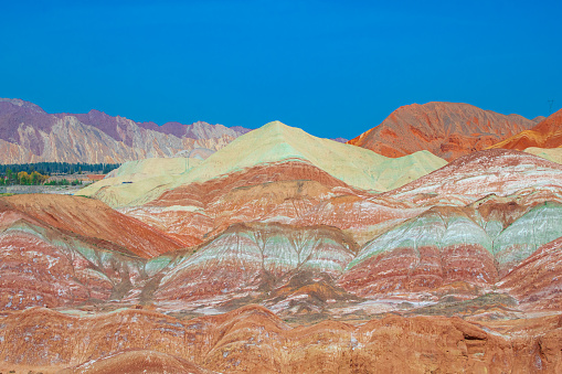 Unique site of The Zhangye Danxia National Park located in the Gansu province in China s northwest is UNESCO World Heritage Site. Rainbow mountains have unusual colours of the rocks. Sunset picture