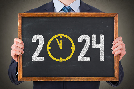 New Year Concepts 2024 Countdown Clock on Blackboard Background