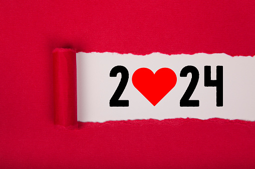 Torn Paper With New Year 2024 with Heart Shape On White Background