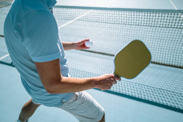 istock Adults Playing Pickleball on a Public Court 1738084373