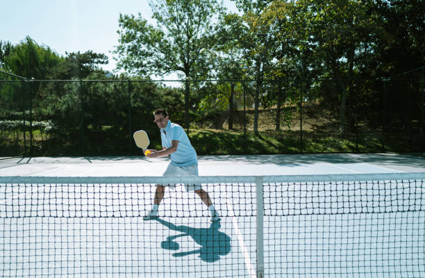 istock Adults Playing Pickleball on a Public Court 1738084898