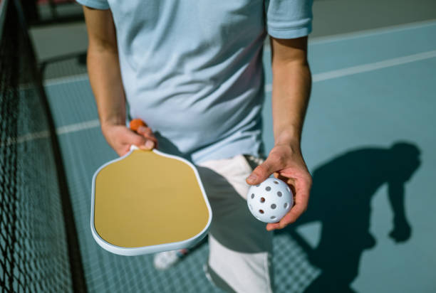 istock Adults Playing Pickleball on a Public Court 1738085467